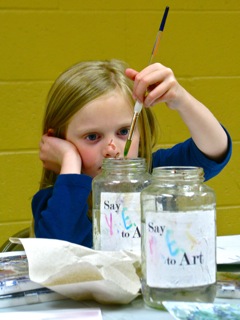 Girl Dipping Brush into Water